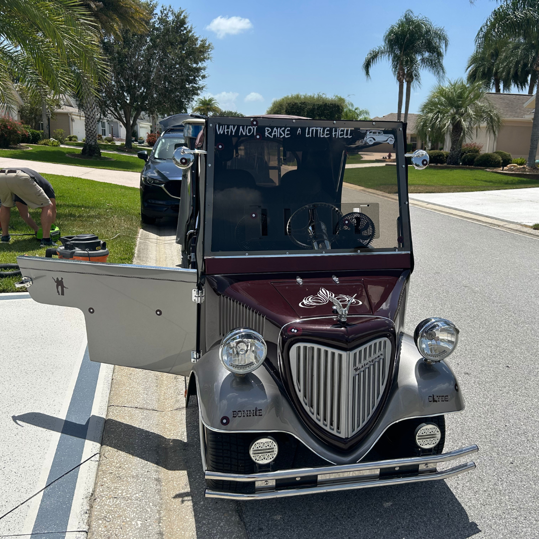 Classic golf cart detailed at a villa driveway in The Villages, Florida