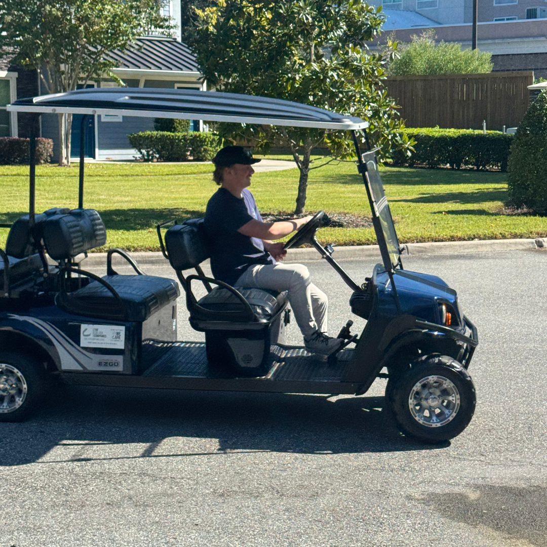 Fleet of golf carts being maintained on-site by Ocala Cart Care technicians in Central Florida